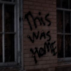 graffiti on the side of a brick building that says this was youth written in black