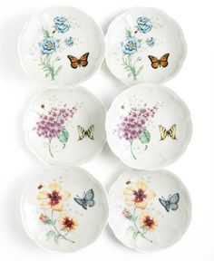 four plates with butterflies and flowers on them for $ 5 99 each or more offers