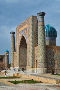 an elaborately decorated building in the middle of a park