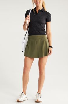 Fall for the lightweight look and feel of this sporty skort designed with a smoothing wide waistband and interior pockets. 14 1/2" length; 4" inseam; 16" leg opening (size Medium) Interior shorts Interior pockets Moisture-wicking fabric engineered for dryness and comfort 78% nylon, 22% spandex Machine wash, tumble dry Imported Casual Mini Skirt With Built-in Shorts And Relaxed Fit, Casual Swim Skirt With Built-in Shorts, Green 4-way Stretch Skort For Workout, Green 4-way Stretch Workout Skort, 4-way Stretch Skort With Built-in Shorts, Athleisure Skort With Wide Waistband For Summer, Summer Athleisure Skort With Wide Waistband, Casual Tennis Skirt With Built-in Shorts, Casual Skirted Skort With 4-way Stretch