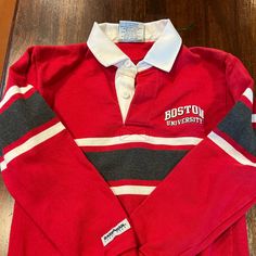 the boston university polo shirt is on display