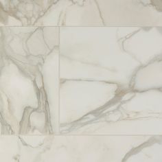 a marble tile floor with white and beige colors