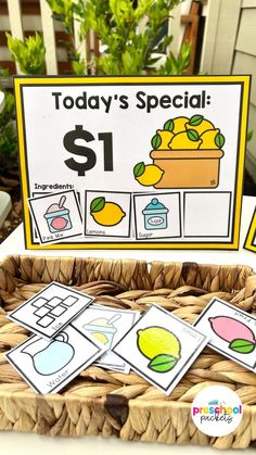 a basket filled with lemons and cutouts to spell out the words today's special $ 1