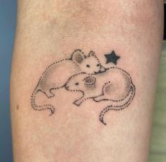 a couple of animals that are on the side of a person's leg with stars