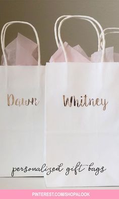 two white paper bags with the words, personalized gift bags on them and pink tissue bags