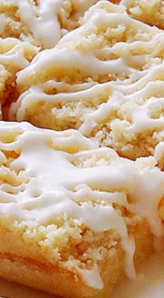 a close up of a piece of cake on a plate with icing and oranges