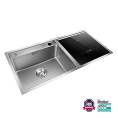 a stainless steel kitchen sink with a black counter top and drainer in the middle