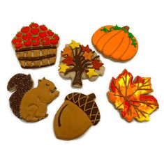 decorated cookies are arranged in the shape of autumn scenes