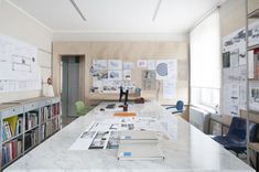 an office with many books on the desk