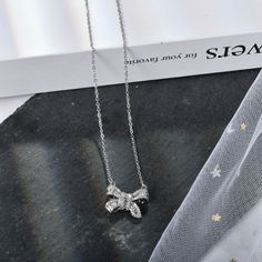 Silver Bow Pendant Necklace ,Simple Stylish Dainty Necklace Dainty necklace for women with bow pendant, looks more elegant and tiny, female must have Can be worn every day for a casual look and paired with the matching necklace pendant to complete your outfit. Suitable for mother or girlfriend, they will be very surprised and happy when they receive it bow necklace length:15.74''+2.55''(extension chain) Thank you so much for your support, if any doubt, please feel free to let me know Dainty Silver Rhinestone Necklace For Party, Dainty Rhinestone Necklace With Adjustable Chain For Party, Elegant Rhinestone Pendant Necklace For Anniversary, Elegant Silver Rhinestone Necklace With Clavicle Chain, Elegant Silver Rhinestone Clavicle Necklace, Mother's Day Party Sterling Silver Necklace, Dainty Rhinestone Choker For Party, Dainty Rhinestone Necklace With Clavicle Chain For Parties, Elegant Butterfly Knot Jewelry Gift