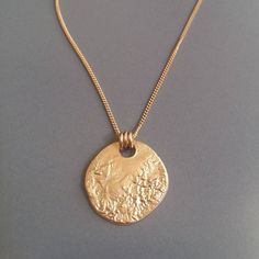 This 18K gold plated MOON necklace is perfect for your day to day life. You can customize by layering other dainty necklaces with it, or let it shine on its own. You can wear this full moon disc necklace all year round with your favorite sweater or sundress. Gold circle necklace is perfect for you, Cheap Metal Necklace With Oval Pendant, Luxury Everyday Hammered Necklaces, Everyday Gold Plated Coin Pendant Necklace, Everyday Gold Plated Pendant Coin Necklace, Gold Minimalist Coin Necklace With Adjustable Chain, Everyday Yellow Gold Plated Coin Necklace, Minimalist Medallion Necklace With Moon Charm, Everyday 14k Gold Filled Coin Necklace, Everyday 14k Gold-filled Coin Necklace