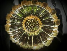 a decorative glass dish sitting on top of a table