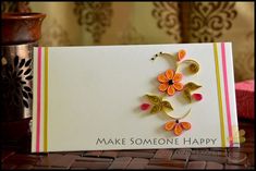 a card with some flowers on it and the words make someone happy written in gold