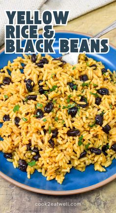 yellow rice and black beans on a blue plate