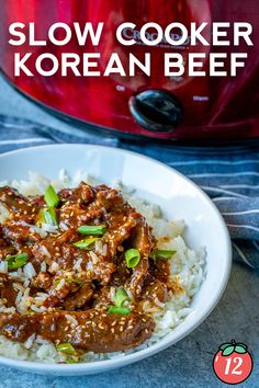 the slow cooker korean beef is ready to be eaten with rice and green onions