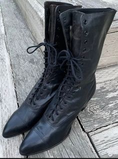 "One of the many Edwardian women's/men's boots that we have for sale in our Etsy TeaTime shop. A fabulous pair of Antique womens Edwardian \"granny\" boots. Black with hints of golden brown bronze colors to the uppers (refer to Photos) made in smooth leather, with natural distressed details that cannot be imitated! 9.5\" inches tall in this 16 grommet hole granny boot. Black Leather sole.*Refer to last photo and condition comments below for Size: no size indicated, refer to measurements below. V Victorian Style Fitted Leather Boots, Vintage Black Lace-up Boots With Round Toe, Edwardian Boots Women, Vintage Black Lace-up Ankle Boots, Fitted Victorian Leather Boots, Rounded Wardrobe, Granny Boots, Victorian Boots, Womens Booties