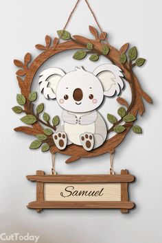 a wooden sign with a koala bear hanging from it's side and the name samuel