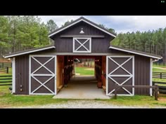 an open barn with two stalls on each side