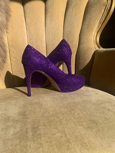 COLOR: This design is created in a darker purple glitter as shown with gold glitter soles. We are able to alter the color and or shade of glitter upon request. Please contact us for color changes.  STYLE: This is a closed toe high heel. If you would like an open toe, please leave a buyers note at checkout about the change.  HEEL HEIGHT: All of our heels come in three heel height ranges. Please select your height in the drop down menu below.  SHIPPING: We ship using 1-3 day priority mail within t Glitter Shoes Heels, Wedding Sneakers For Bride, Bling Wedding Shoes, Glitter Wedding Shoes, Womens Costume, Glitter High Heels, Wedding Sneakers, Purple Heels, Custom Bling