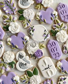 decorated cookies with wedding date and flowers on them