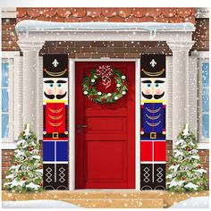 a red door decorated with nutcrackers and wreath