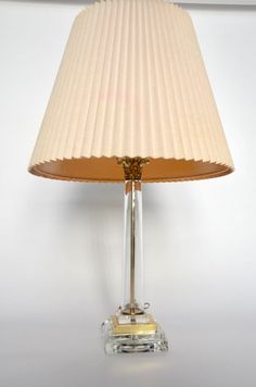 A brass & glass vintage regency style lamp. Has Corinthian column detailing at the neck and a thick glass & brass base. Unique and very modern-looking. Selling base-only. In wonderful working condition.  Dimensions: 20"l x 5"w. Corinthian Column, Live Light, Table Lamps, Vintage Brass, Lamp Shade, Lamp Light, Lamps, Table Lamp, Shades