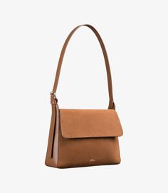 A.P.C. Women's bag.- Bag in smooth leather and suede.- Leather panel.- Inside pocket.- Small pouch attached to the base.- Adjustable leather strap.- Can be carried on the shoulder.- Goldtone hardware.- Embossed goldtone A.P.C. logo on the small interior pouch.- Embossed goldtone ""A.P.C. Rue Madame Paris"" logo." Leather Panel, Paris Logo, Faux Leather Bag, Small Pouch, C Logo, Backpack Tote Bag, Small Pouches, Bag Bag, Tote Backpack