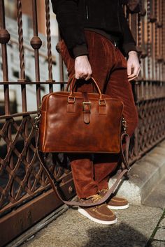 "This brown cowhide leather Briedfcase is 100% handmade. Our briefcase created especially for a person who is looking for a stylish but also functional bag. It's perfect at work and for everyday urban life. You can carry all your stuff, mobile phone and iPad perfectly organized. it has some inner pockets and 2 outter. the cross body strap is adjustable. like all of my shop's product, this bag is also design and made by Alma Milano. and it's 100% handmade Dimentions: -height :28 Cm / 11'' - Width Rectangular Oiled Leather Briefcase For Daily Use, Leather Briefcase With Luggage Sleeve In Cognac, Leather Travel Briefcase With Strap, Leather Travel Briefcase With Leather Strap, Travel Leather Briefcase With Strap, Cognac Leather Briefcase With Luggage Sleeve, Brown Leather Strap Briefcase For Business, Formal Rectangular Briefcase With Leather Strap, Everyday Bridle Leather Rectangular Briefcase