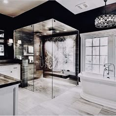 a large bathroom with a tub, sink and shower in the middle of it's walls