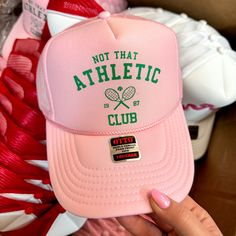 Not That Athletic Club Foam Trucker Hat in Light Pink - Giddy Up Glamour Boutique Cheap Team-colored Trucker Hat For Fans, Spring Sports Trucker Hat, Graphic Trucker Hat, Spring Adjustable Trucker Hat For Sports Events, Trendy 5-panel Letter Print Baseball Cap, Spring Sports Trucker Hat, One Size Fits Most, Spring Sports Trucker Baseball Cap, Sporty Hats With Letter Print For Spring, Spring Sports Trucker Hat One Size