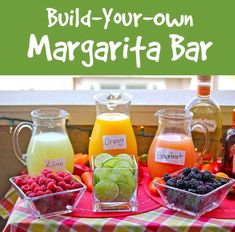 build - your - own margarita bar with fresh fruit and juices on the table