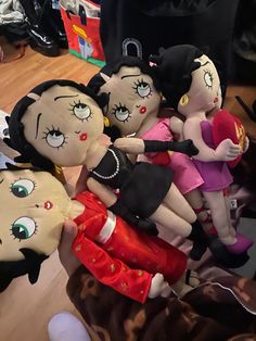 several stuffed dolls are stacked on top of each other