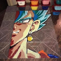 the rug is made out of legos and has an image of gohan on it