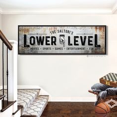 a sign that reads lower level level hangs on the wall next to a basket full of items