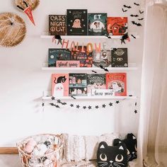 there are many books on the shelves above the bed and in front of the window