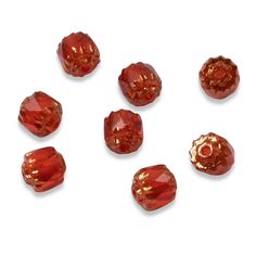 six red glass beads on a white background