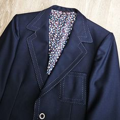 "Vintage 60s 70s Phoenix Slate Blue 2 Button Blazer. Jacket is in excellent condition.  No rips, holes, or stains.   Barely any noticeable signs of wear.  See pictures for details.   Polyester or polyester blend.  Iridescent, sharkskin like fabric.   Cuffed Sleeve.  White Stitch Accent.   Notch Lapel.  Single  Rear Vent .  Union Made in U.S.A. Size 38 R Pit to pit:  20.5\"    Length (collar seam to hem):  29.25\"    Shoulder to shoulder:  17\"    Shoulder seam to cuff:  25\"" Mens Sport Coat, Union Made, Blazers For Men, Blazer Buttons, Slate Blue, Vintage 60s, Cuff Sleeves, Sport Coat, Blazer Jacket