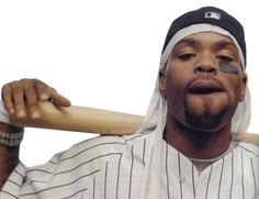 a baseball player holding a bat and wearing a headscarf on top of his head