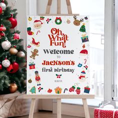 a sign that says, oh what fun welcome to jackson's first birthday next to a christmas tree