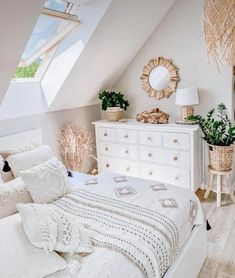 a bedroom with a bed, dresser and window