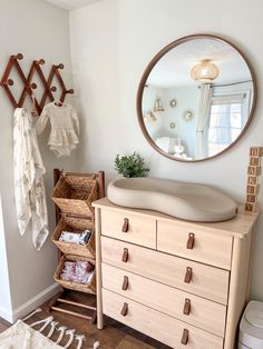 a dresser and mirror in a small room