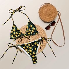 A Fresh and Zesty Summer Look Only Achievable in the Lemons Recycled String Bikini! Refresh your summer with string bikini vibes in Lemons – your vibrant choice for stylish summer dips. Made from soft recycled polyester with double-layering and UPF 50+, this All-Over Print set ensures a comfortable and refreshing experience. The bikini top, featuring removable padding, offers multiple ways to tie and style the straps. With sizes up to 6XL, this string bikini is the perfect choice for a chic and Summer String Swimwear For Swimming, String Swimwear For Summer Swimming, Adjustable Swimwear For Beach Party Vacation, Adjustable Swimwear For Vacation, String Swimwear For Sunbathing And Beach Season, Adjustable Yellow Swimwear For The Pool, String Swimwear For Beach Season Vacation, String Swimwear For Beach Vacation, String Swimwear For Vacation And Beach Season