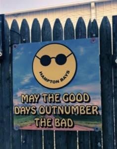 a sign on a fence that says may the good days outnumber the bad