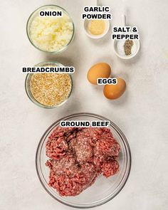 ingredients to make ground beef are shown in bowls on a white surface, including eggs, garlic, flour, salt and pepper