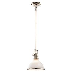 a light hanging from the ceiling in an industrial style fixture with a white glass shade