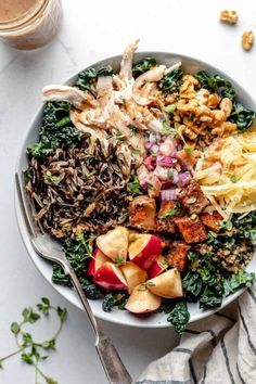 a white bowl filled with different types of food