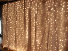 the curtain is covered with white lights