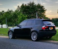 an suv parked on the side of the road