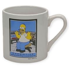 a white coffee mug with the simpsons on it