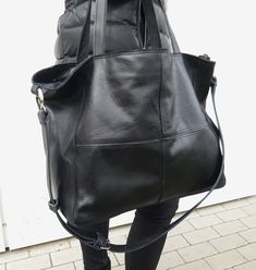 Leather bag in black, soft and big. The front decorative stitching Bag Zippered. Handles 58 cm. Complete with a long strap, you can adjust the length to be worn on the arm, max. l. 110 cm. Leather soft, genuine leather, high quality. In the middle the lining; inside a large zip pocket and a smaller leather pocked on the phone. h. 34cm, width 54 cm, depth of 16 cm . If you want a bag of this leather in other dimensions - write in the comments to the order, the price does not change. Free standard Modern Black Leather Hobo Bag, Black Soft Leather Bag With Double Handle, Black Soft Leather Satchel With Double Handle, Modern Black Leather Backpack With Double Handle, Versatile Black Leather Bag, Black Soft Leather Bag For Daily Use, Versatile Black Soft Leather Bag, Black Hobo Satchel For Errands, Black Leather Hobo Bag For Daily Use